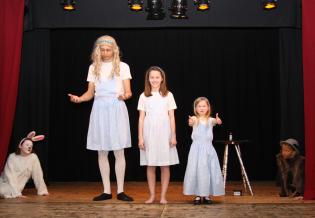 <em>Alice in Wonderland</em> Article Photo - The three Alices, the White Rabbit and the Dormouse
